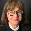 Portrait of woman with glasses.