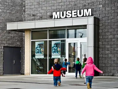 two children running into the Museum entrance 