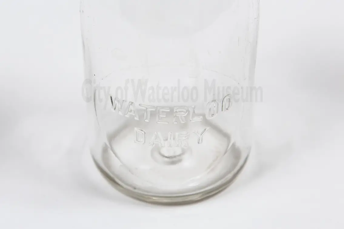 Image shows an up close view of a milk bottle and it's label that reads "Waterloo Diary"