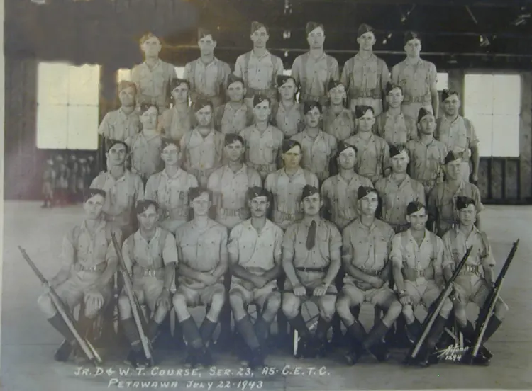 Image of five rows of uniformed men