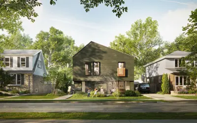 Two-storey fourplex with a simple, modern design on a residential street with neighbouring single-family homes.