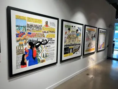 Paintings and prints on a wall exhibt