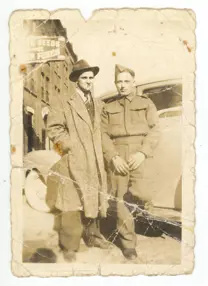 Image of man in uniform with man in hat