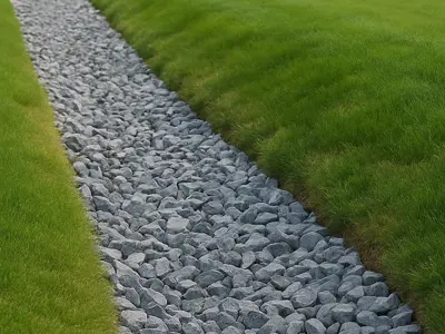 Illustration of an infiltration trench showing a gravel-filled pit beneath grass. The trench allows rainwater to soak into the ground instead of running off the surface.