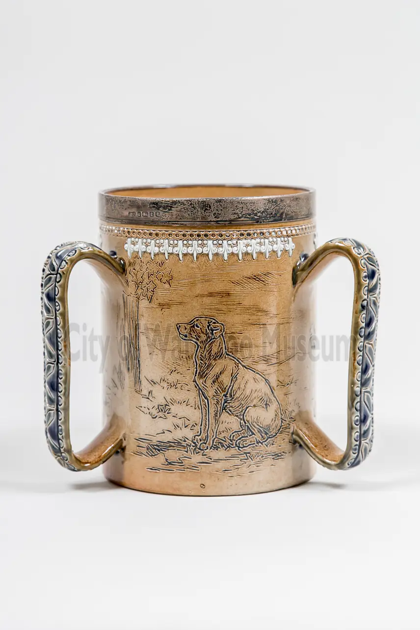 Side view of loving cup showing detailed handle design
