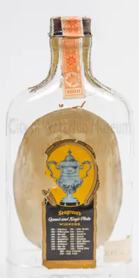 Back of bottle with label listing 20 King's and Queen's Plate winners between 1891 and 1935