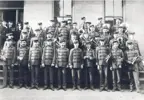Black and white photo of the Waterloo Musical Society Band standing in front of a building