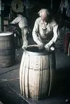 Seagram barrel worker checking the barrel