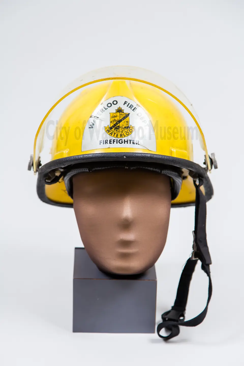 Yellow Fire Helmet modeled on a mannequin head for size reference