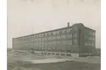 Black and white photo of the Dominion Tire Factory just after completion