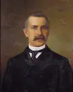 Oil painting on canvas of Jacob Uffelman wearing black suit with brown background.