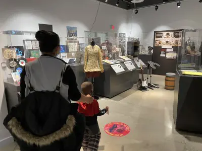 Woman and child walking through exhibit
