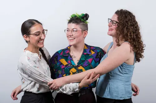 Image of three women laughing