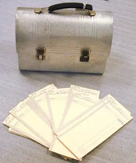 Image of punch cards and lunch box