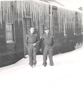 Image of two men in uniform in snow