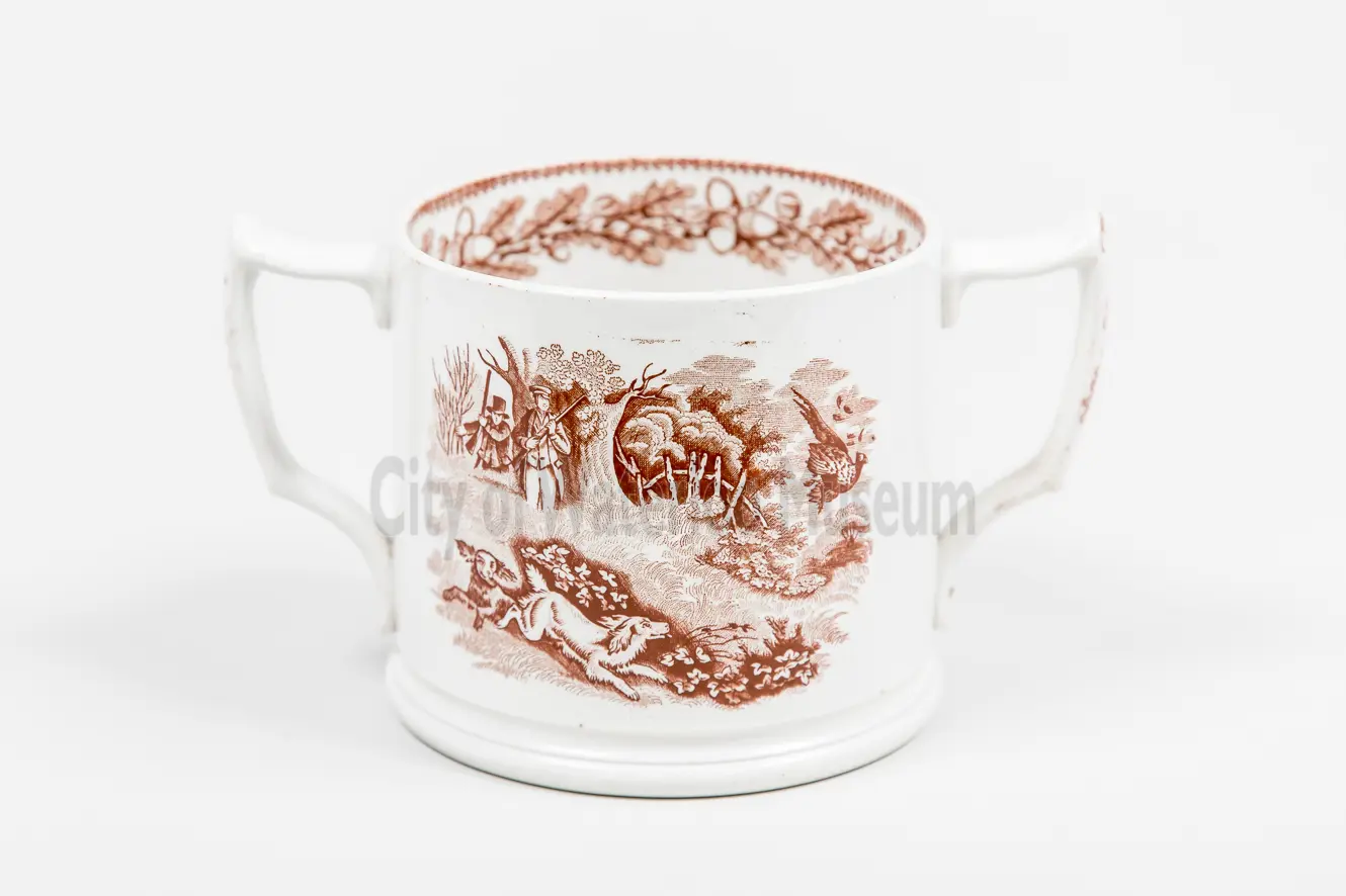 Front view of tall trophy-style loving cup