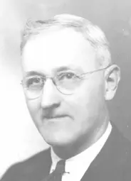 Image of man in suit with glasses