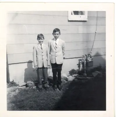 Image of two boys dressed up in suits