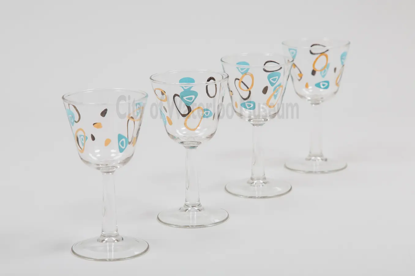 Glassware set with teal and gold amoeba pattern