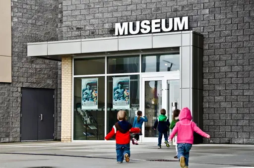 Image of children running towards museum entrance