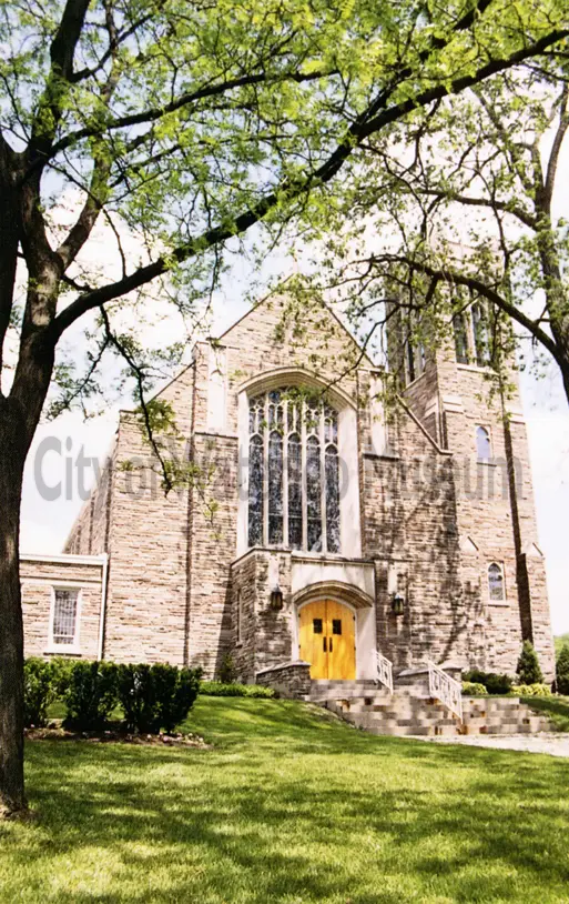 Front of postcard showing a photo of the front of St. John Lutheran Church in colour