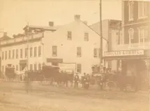 Black and white photo of King Street with Diebel's storefront beside Zimmerman Hotel.