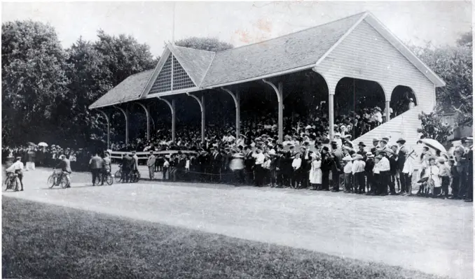Archival photo of the old wooden grandstand at Waterloo Park’s athletic field, filled with spectators and showing its tiered seating design.