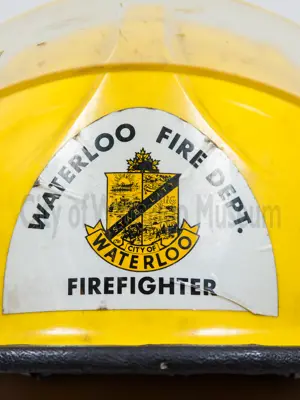 Yellow Fire Helmet showing the Waterloo Fire Department Crest