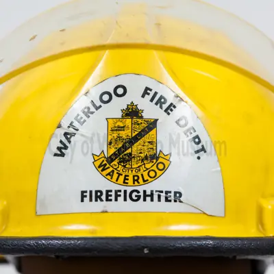 Yellow Fire Helmet showing the Waterloo Fire Department Crest