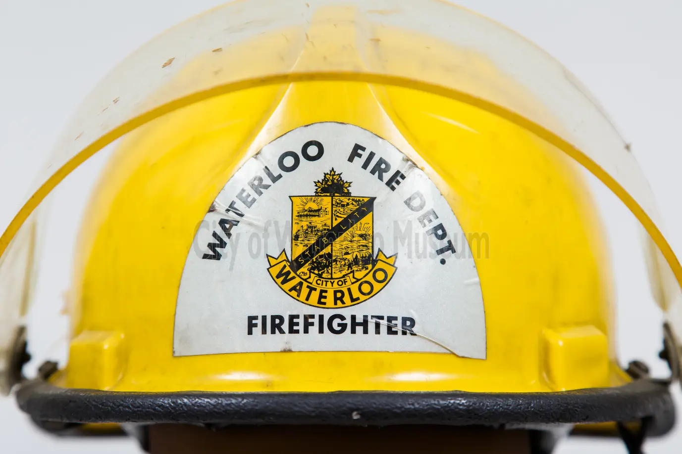 Yellow Fire Helmet showing the Waterloo Fire Department Crest