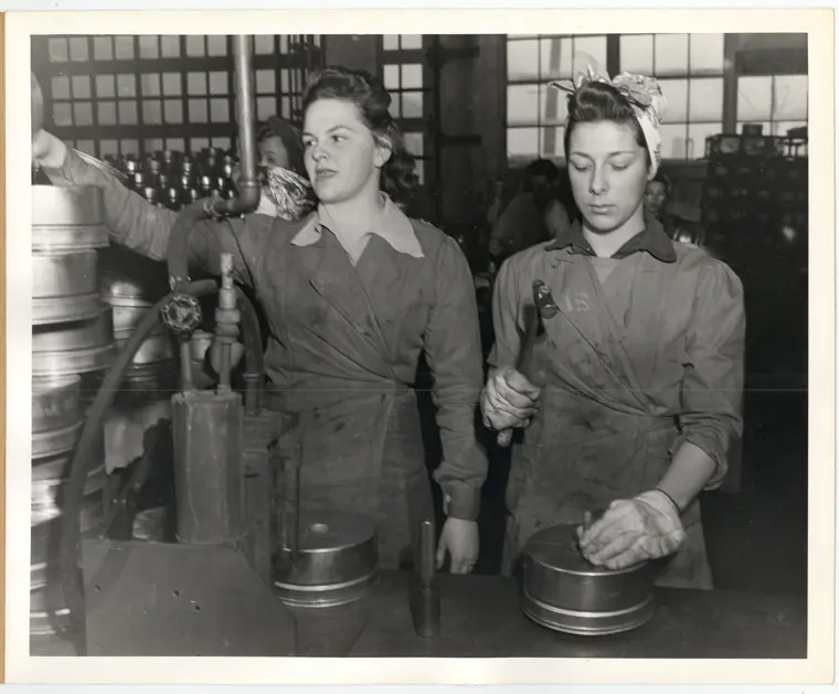 Image of women inspecting anti-tank mine bodies