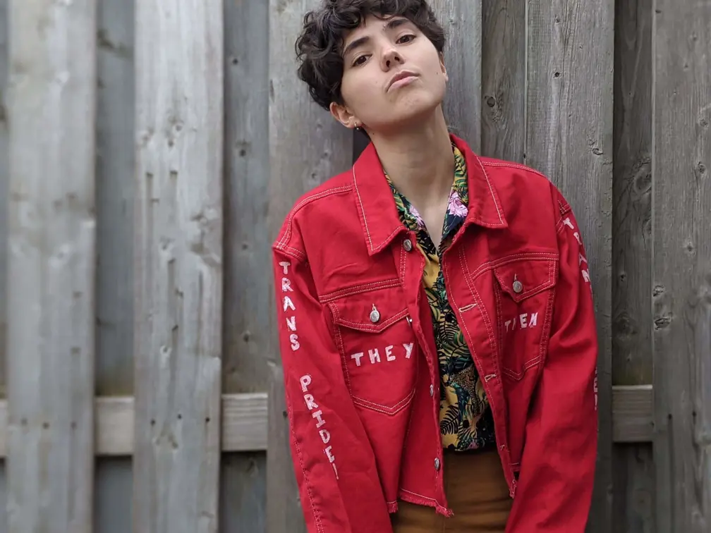 Portrait of individual with red jacket