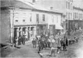 Black and white photo of workmen digging on King Street