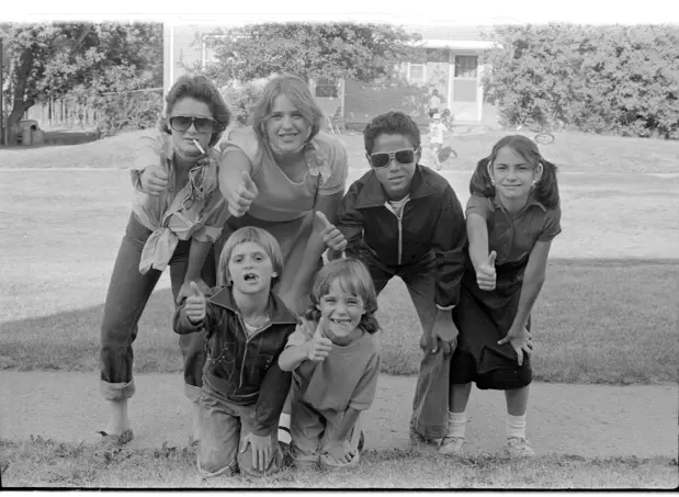 Image of six kids posted on sidewalk